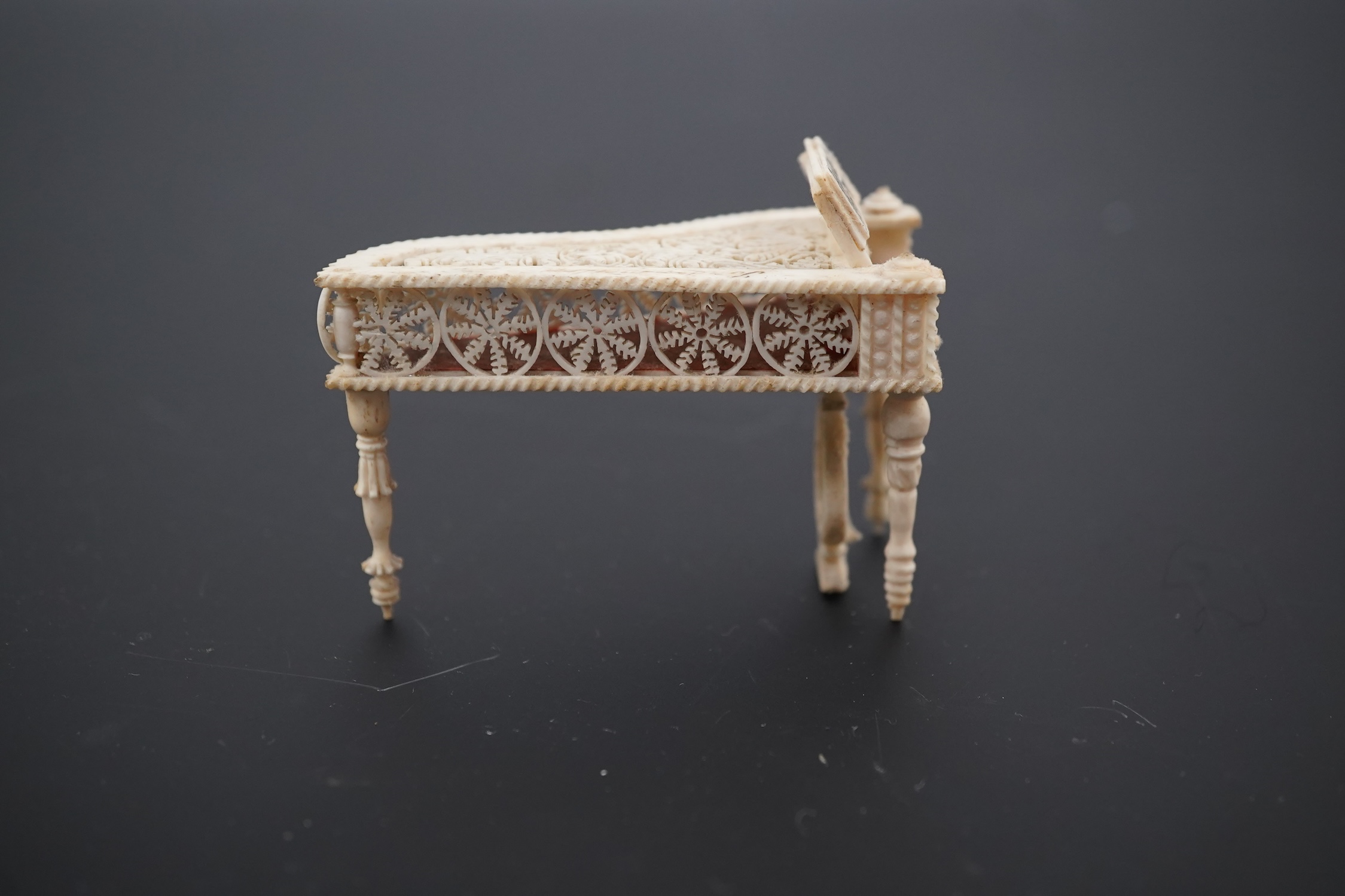 A Napoleonic Prisoner of War bone miniature model of a harpsichord, 6.5cm long. Condition - good